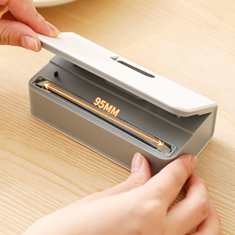 Rechargeable magnetic bag sealer with cutter